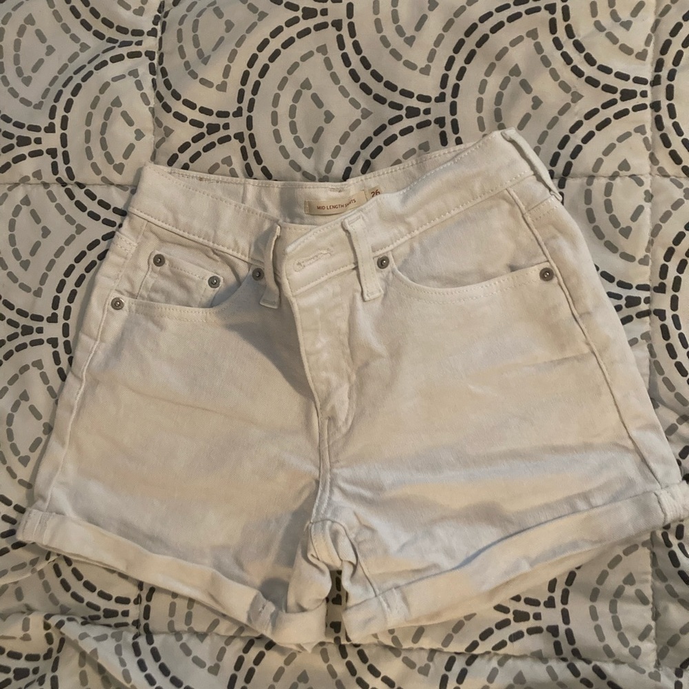White white white!! Mid rise white  Levi’s jean shorts